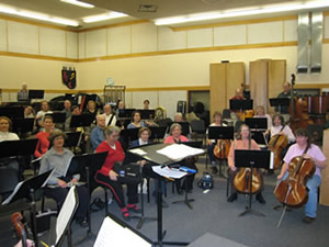picture of the orchestra rehearsing